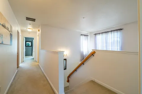 a bedroom with a bed and a table