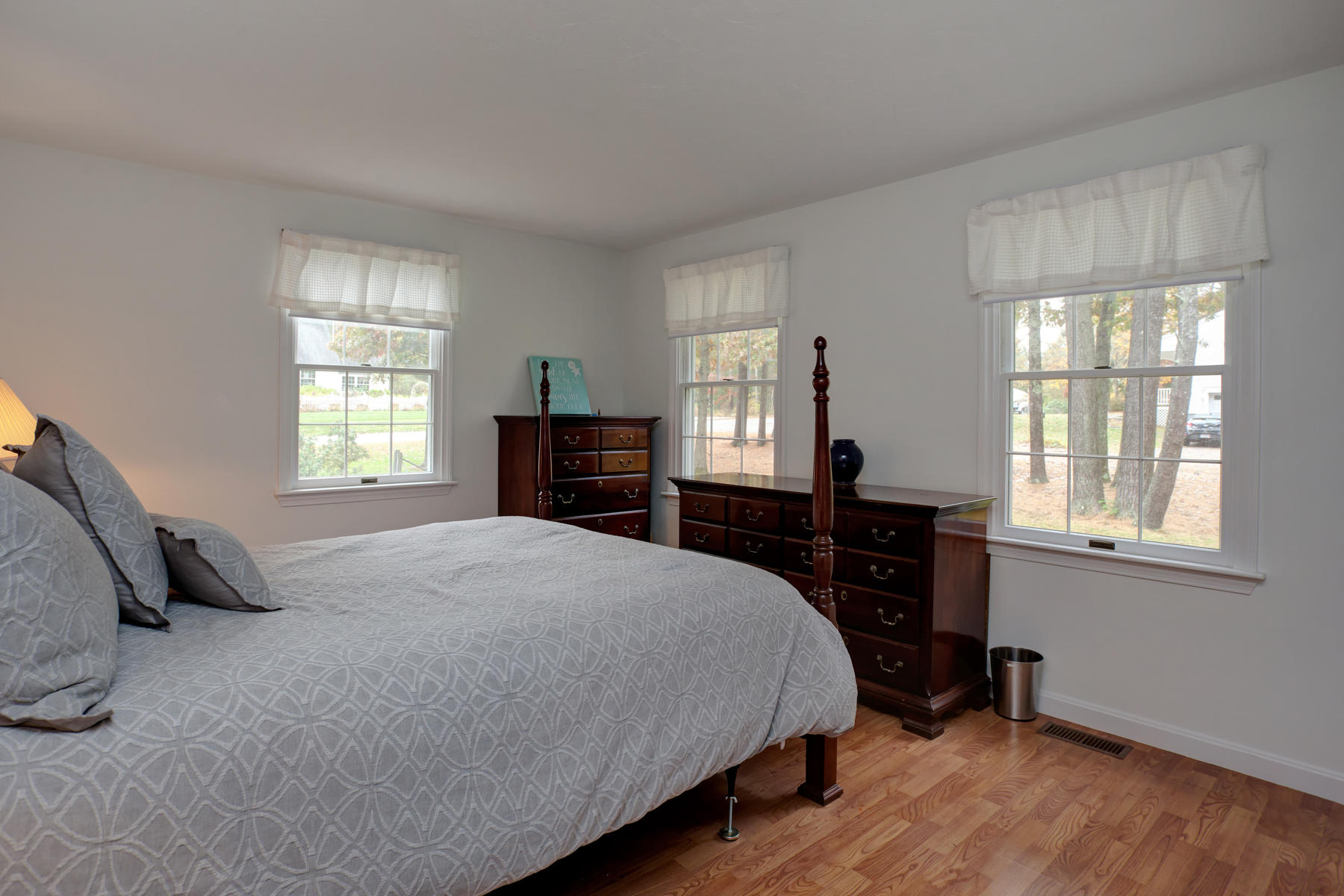 2 Timberknoll Road Pocasset, MA 02559 - Photo 12 of 26 a bedroom with a bed and wooden floor