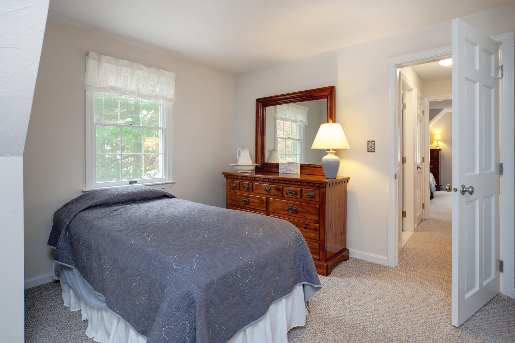 2 Timberknoll Road Pocasset, MA 02559 - Photo 15 of 26 a bed sitting in a bedroom next to a window