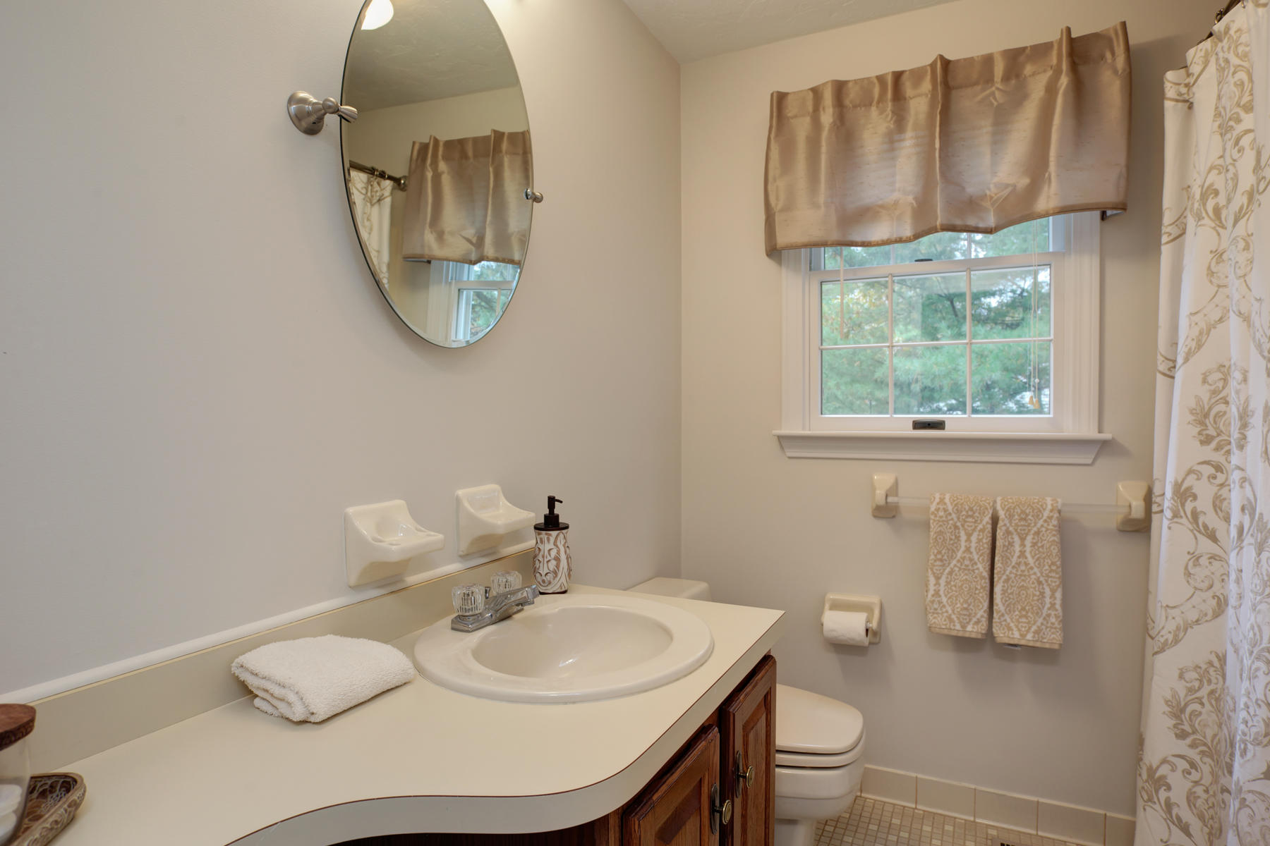 2 Timberknoll Road Pocasset, MA 02559 - Photo 17 of 26 a bathroom with a sink toilet and a mirror