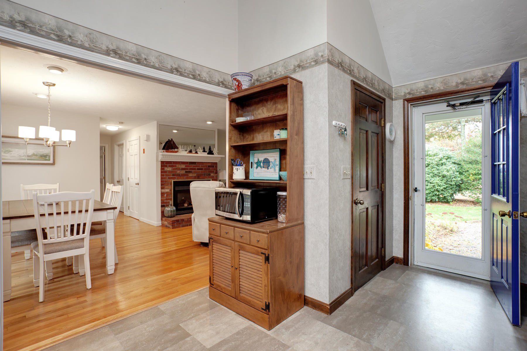 2 Timberknoll Road Pocasset, MA 02559 - Photo 2 of 26 a living room with stainless steel appliances kitchen island granite countertop furniture and a wooden floor