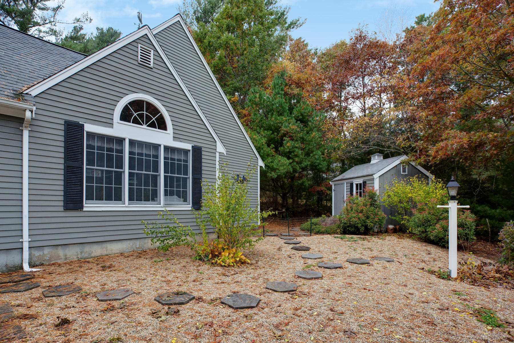 2 Timberknoll Road Pocasset, MA 02559 - Photo 23 of 26 a view of a house with a yard and plants