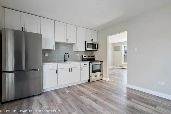a kitchen with a refrigerator a sink and dishwasher