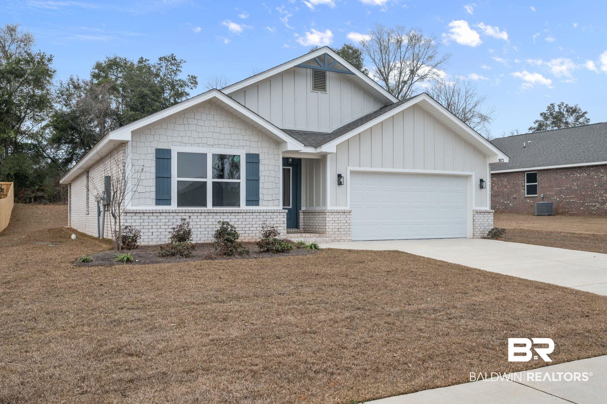 16272 Laurelbrooke Loop Fairhope, AL 36532 - Photo 7 of 40 Craftsman house featuring a garage, central AC unit, and a front lawn