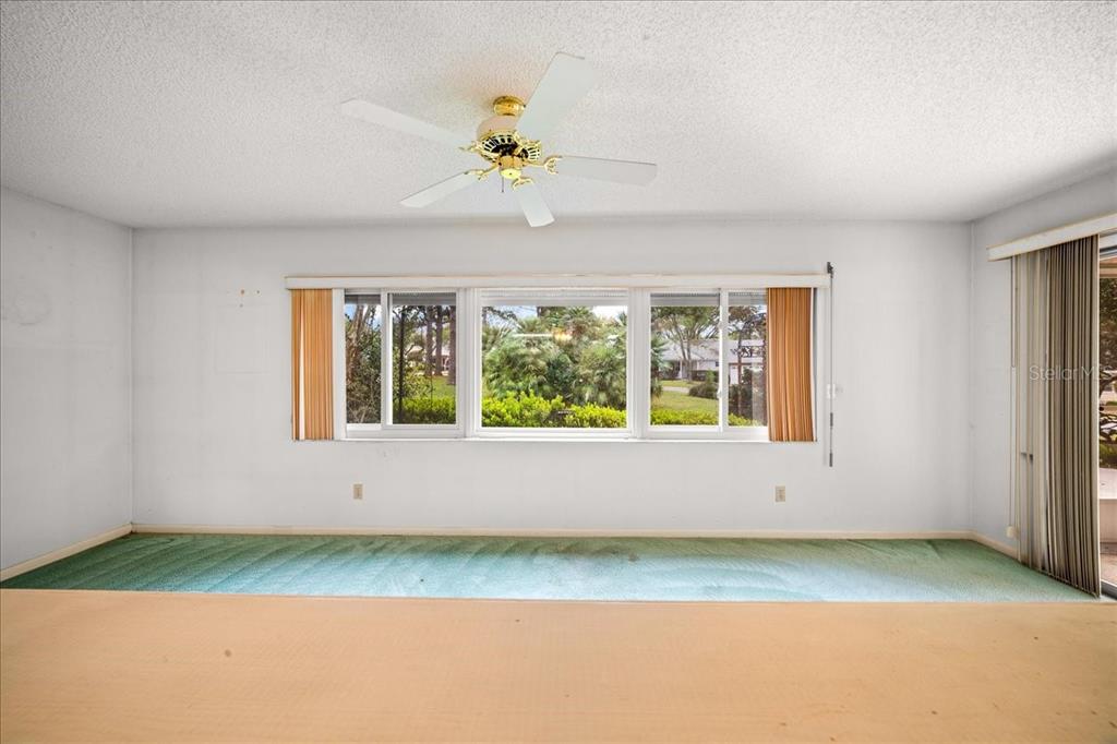 9377 Southwest 90th Court, Unit E Ocala, FL 34481 - Photo 26 of 77 a view of an empty room with a window