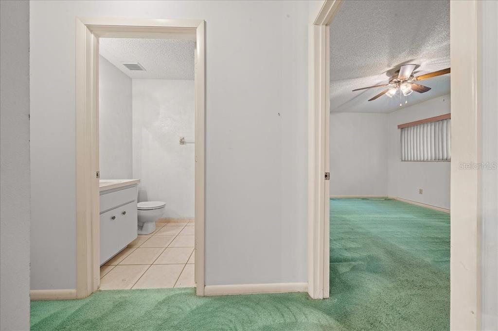 9377 Southwest 90th Court, Unit E Ocala, FL 34481 - Photo 29 of 77 a view of a bathroom from the hallway