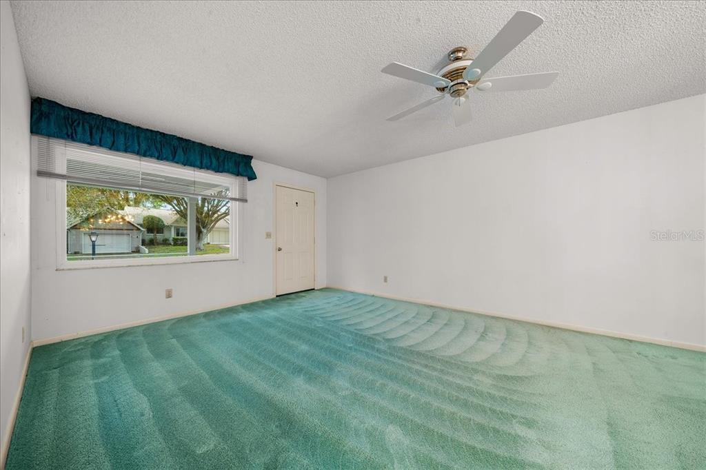 9377 Southwest 90th Court, Unit E Ocala, FL 34481 - Photo 30 of 77 a view of an empty room with a window