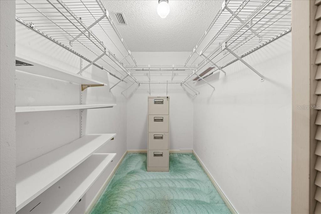 9377 Southwest 90th Court, Unit E Ocala, FL 34481 - Photo 33 of 77 a view of walk in closet