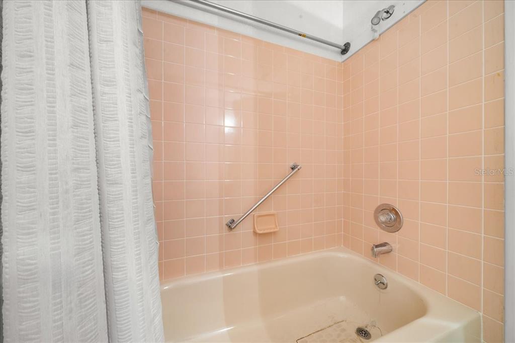9377 Southwest 90th Court, Unit E Ocala, FL 34481 - Photo 36 of 77 a bathroom with a bathtub