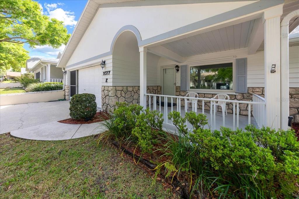 9377 Southwest 90th Court, Unit E Ocala, FL 34481 - Photo 10 of 77 a house view with a outdoor space