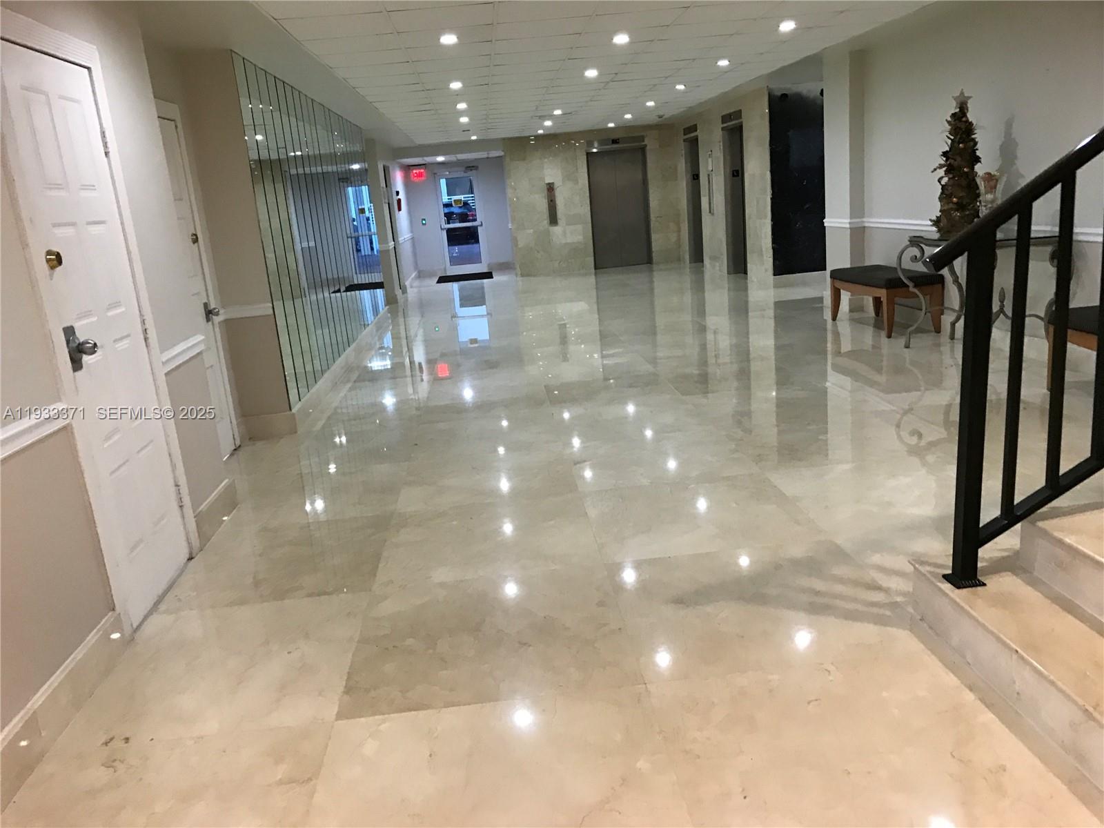 5005 Collins Avenue, Unit 715 Miami Beach, FL 33140 - Photo 3 of 19 Hall to the elevators