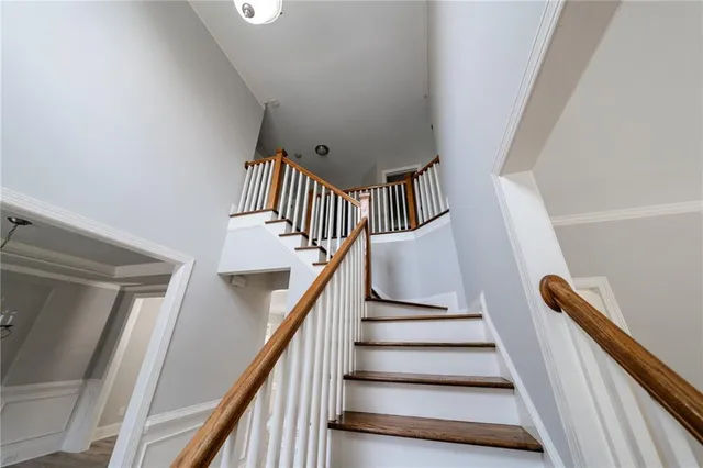 wooden floor in an empty room with a mirror