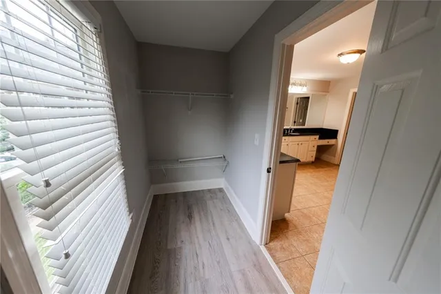 a bathroom with a double vanity sink a and mirror
