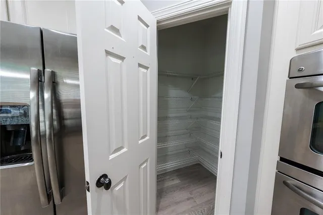 a bathroom with a glass door shower and a sink