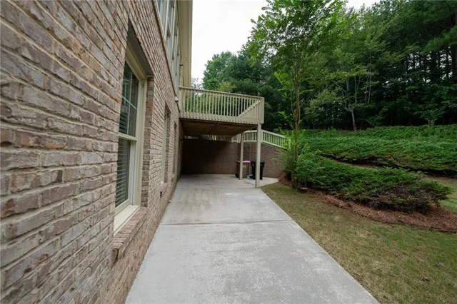 an aerial view of a house a yard and outdoor seating