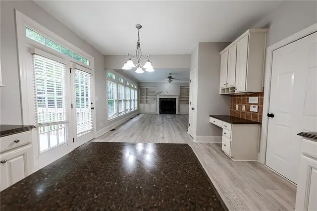 a view of a kitchen with a sink and a window