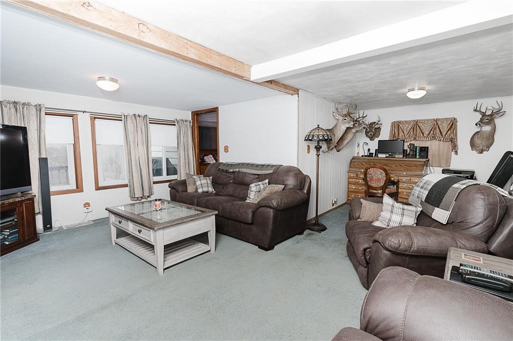 478 Exton Lake Road Apollo, PA 15613 - Photo 12 of 25 a living room with furniture and a flat screen tv