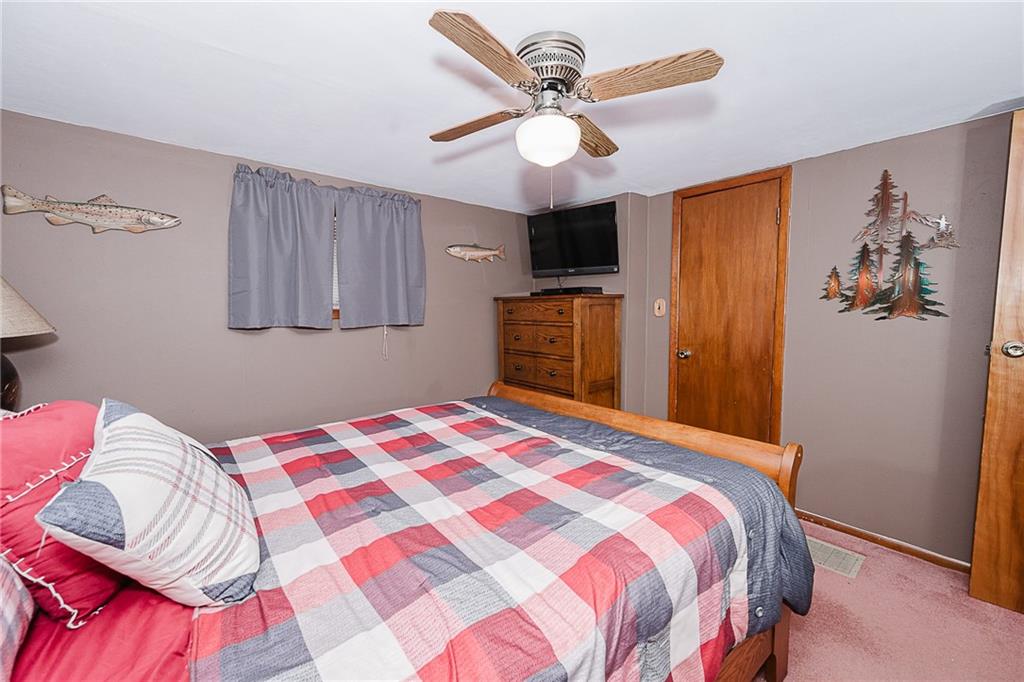 478 Exton Lake Road Apollo, PA 15613 - Photo 14 of 25 a bedroom with a bed and a flat screen tv