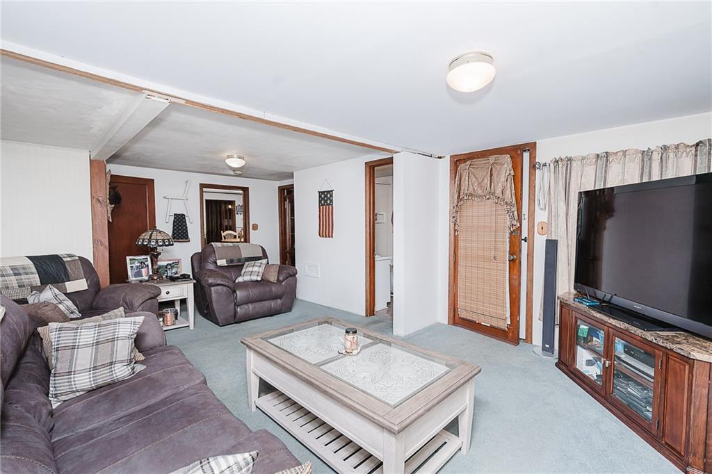 478 Exton Lake Road Apollo, PA 15613 - Photo 10 of 25 a living room with furniture and a flat screen tv