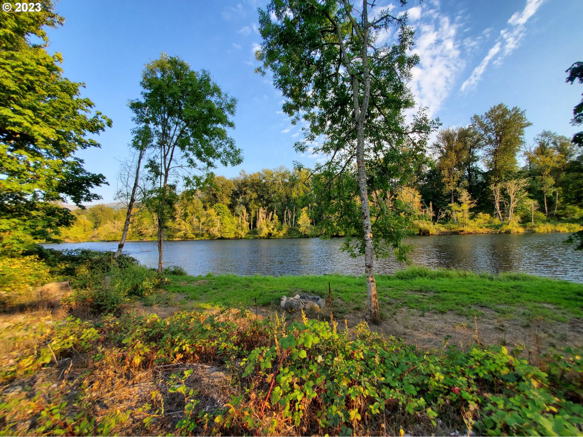 Mckenzie Highway Springfield, OR 97478 - Photo 19 of 29 a view of a lake with a garden