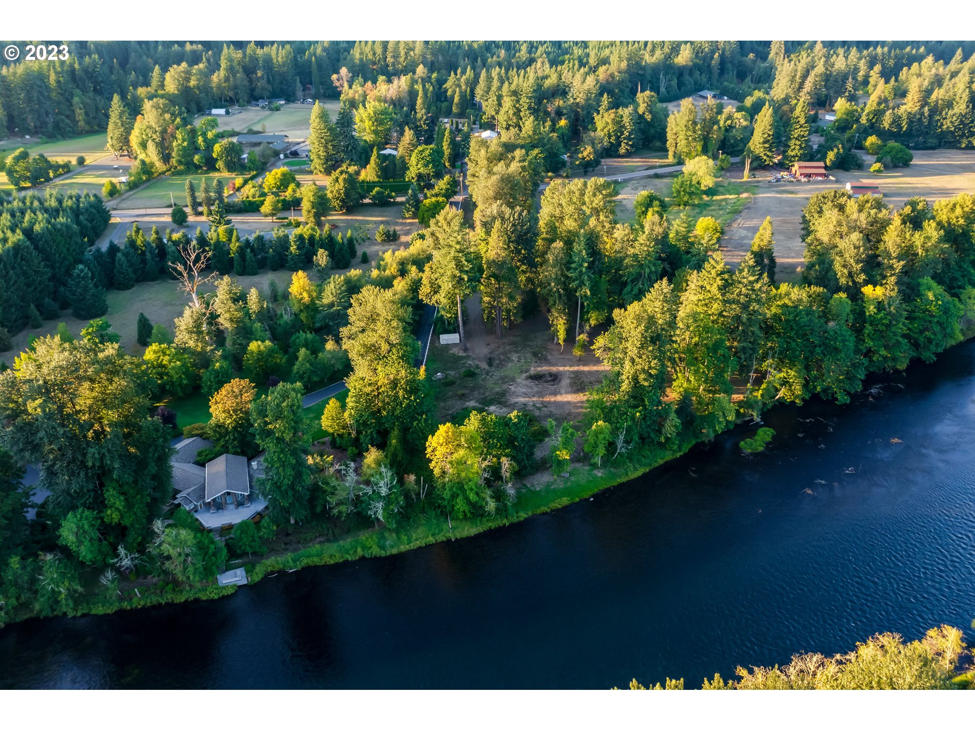 Mckenzie Highway Springfield, OR 97478 - Photo 2 of 29 a view of a lake with a building in the background