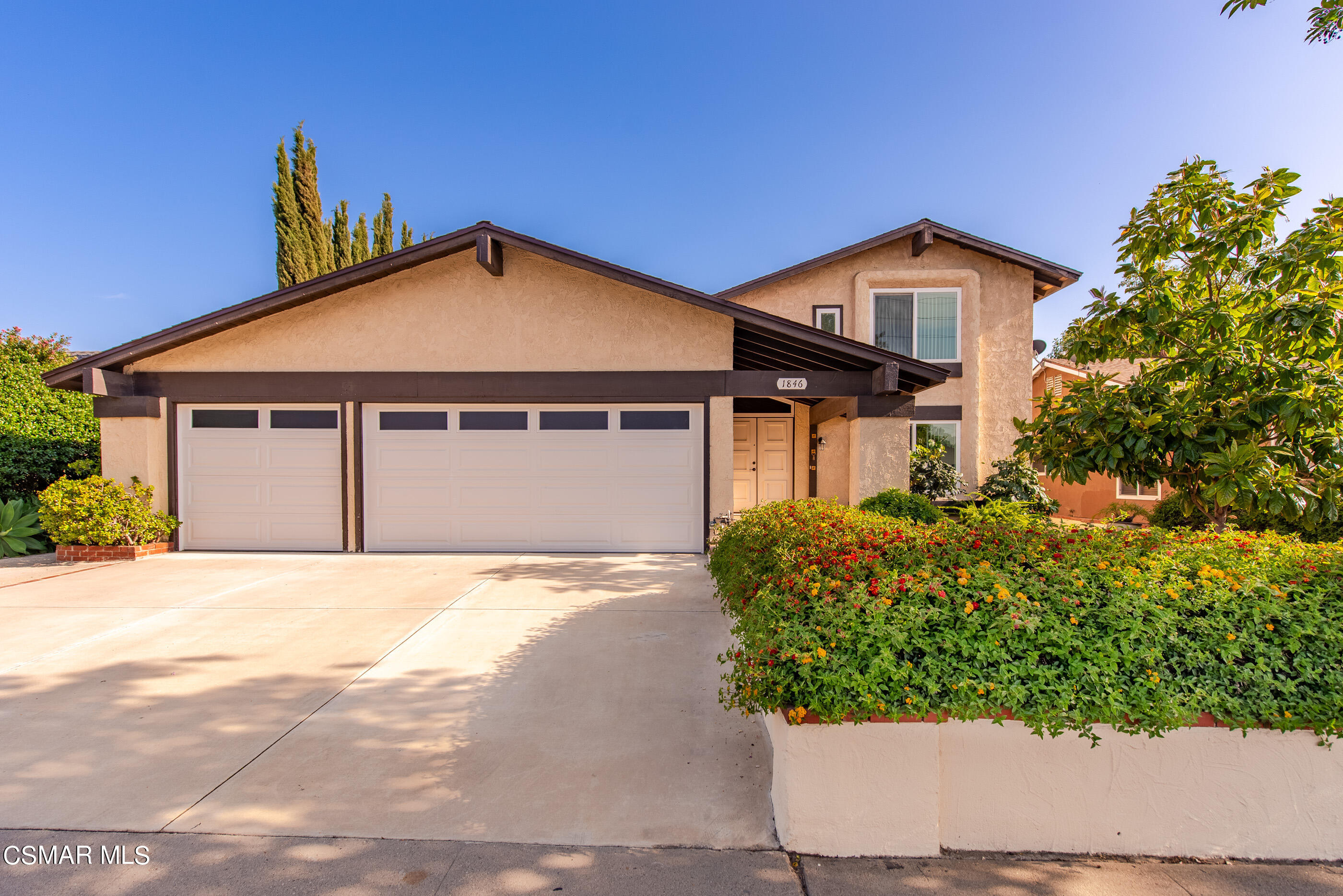1846 Fitzgerald Road Simi Valley, CA 93065 - Photo 1 of 29 a front view of a house with a yard and potted plants