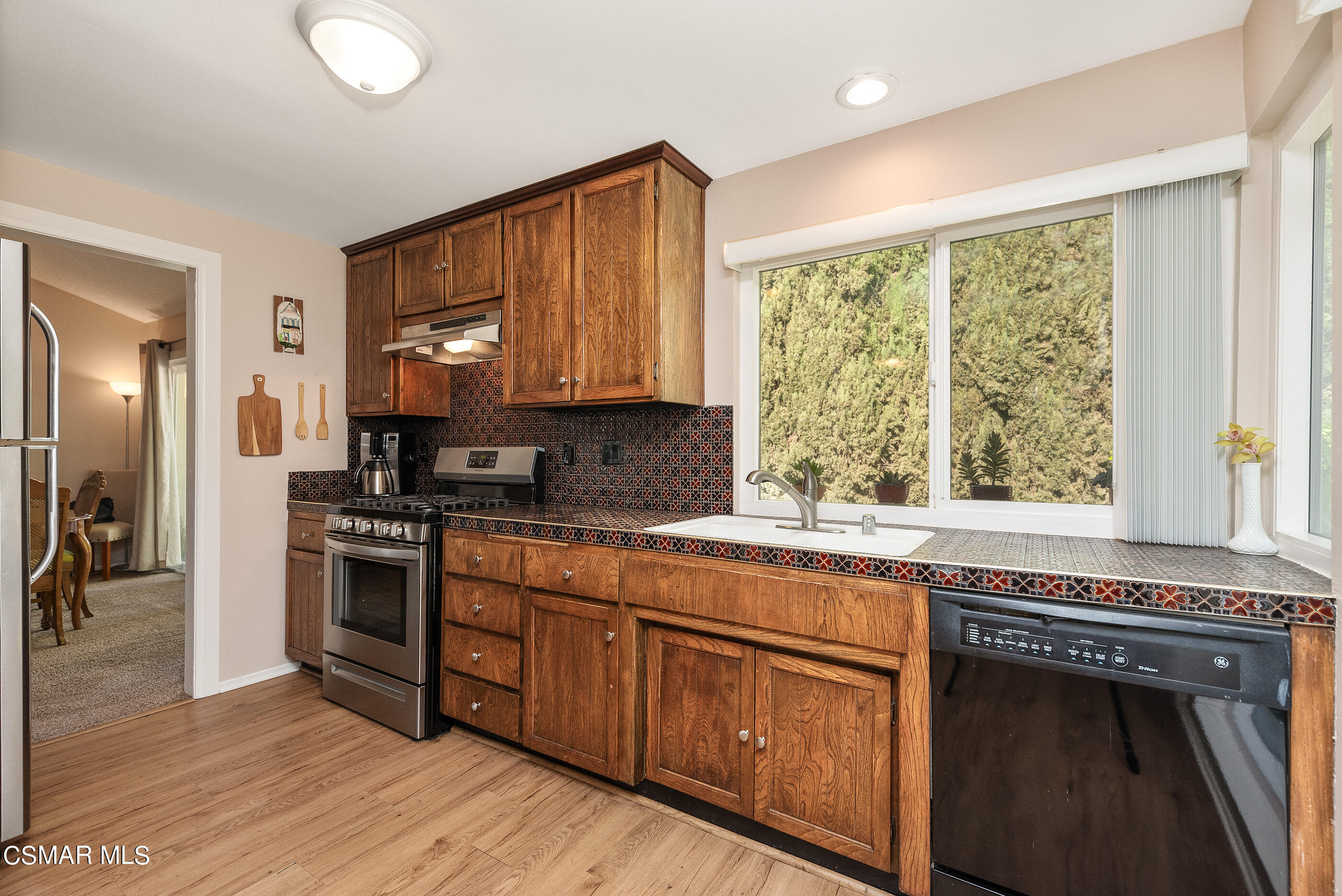 1846 Fitzgerald Road Simi Valley, CA 93065 - Photo 8 of 29 a kitchen with stainless steel appliances granite countertop a stove a sink and a refrigerator