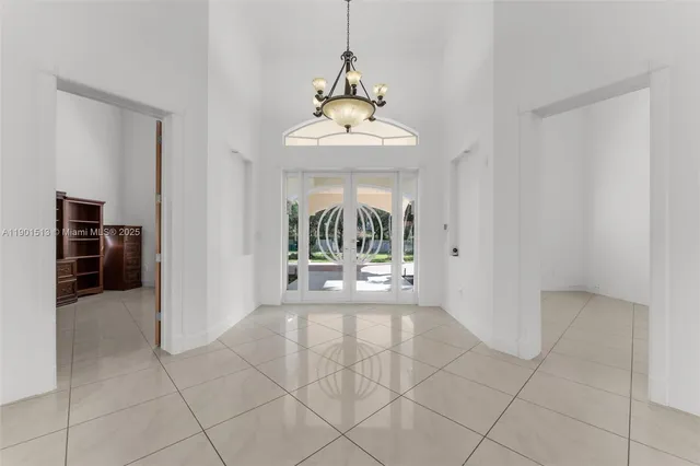 a kitchen with stainless steel appliances kitchen island granite countertop a sink and cabinets