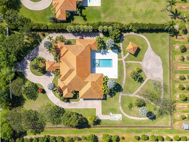 a large bathroom with a large tub and sink