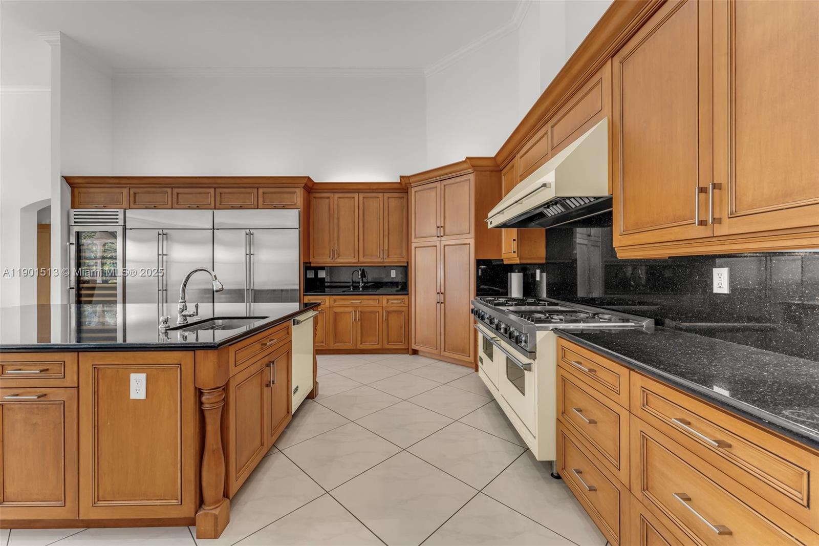 14950 Southwest 179th Avenue Miami, FL 33196 - Photo 17 of 55 a kitchen with stainless steel appliances granite countertop a stove a sink and a refrigerator