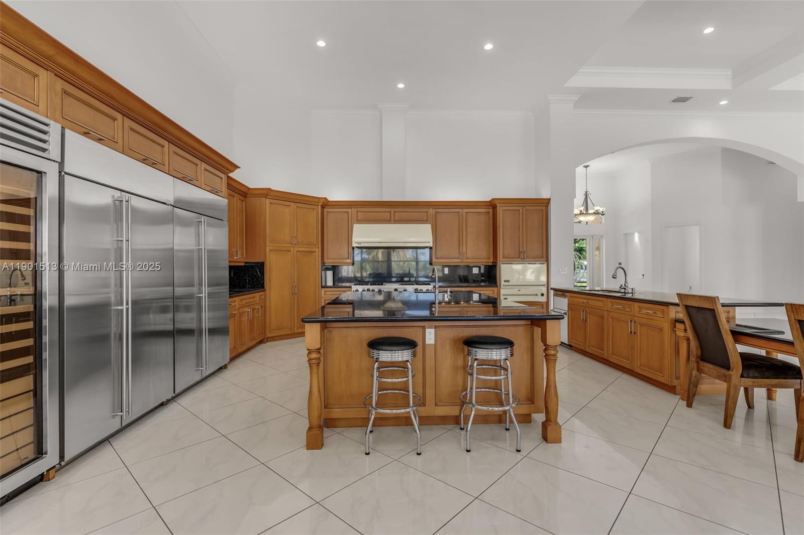 14950 Southwest 179th Avenue Miami, FL 33196 - Photo 18 of 55 a kitchen with a sink and chairs