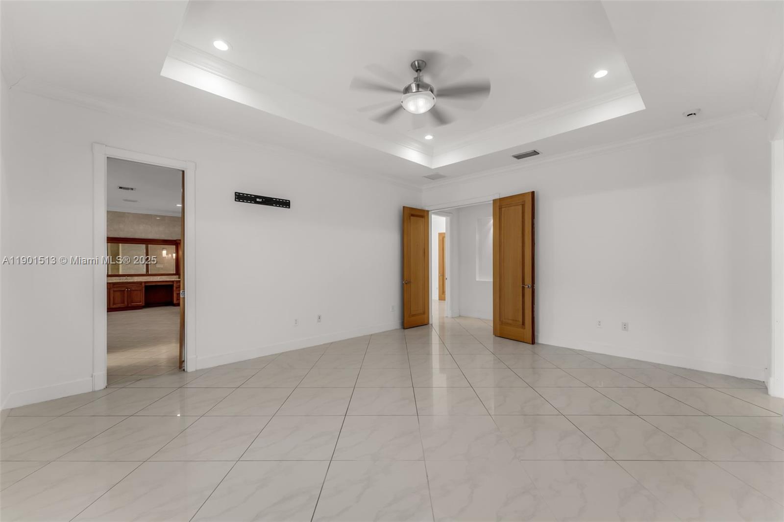 14950 Southwest 179th Avenue Miami, FL 33196 - Photo 31 of 55 an empty room with closet and fan