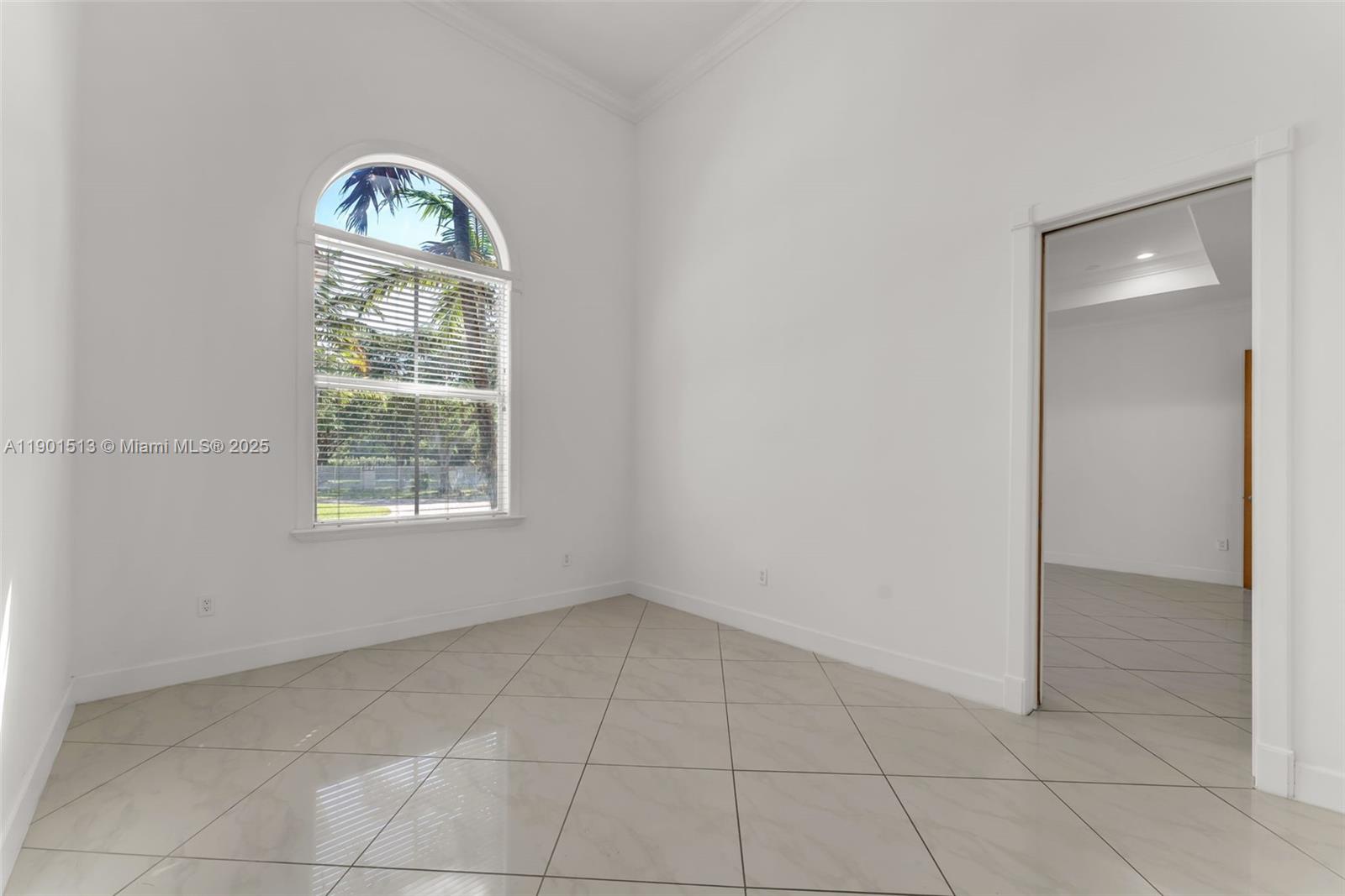 14950 Southwest 179th Avenue Miami, FL 33196 - Photo 34 of 55 an empty room with a window