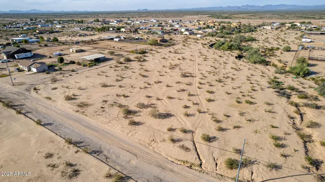 an aerial view of house with yard