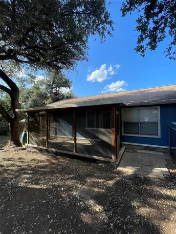 a view of house with backyard