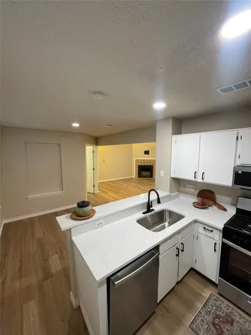a kitchen that has a sink and a stove