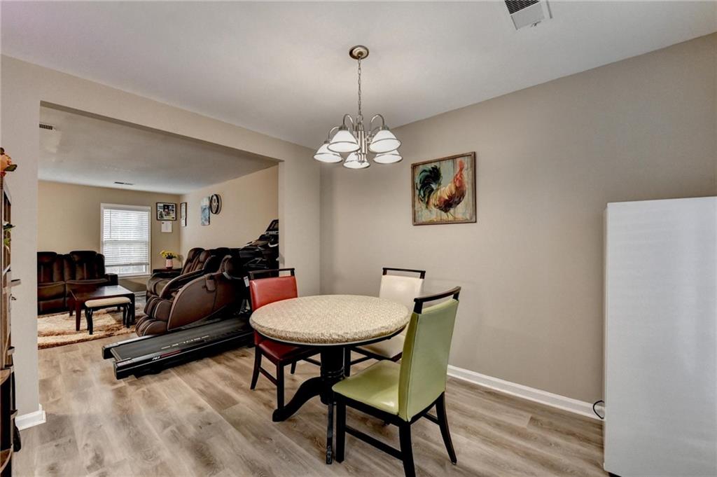 992 Old Holcomb Bridge Road Roswell, GA 30076 - Photo 12 of 34 a living room with furniture and a table