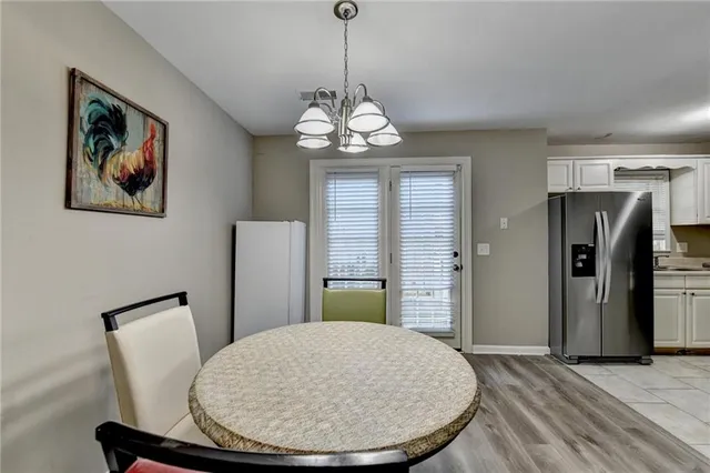 a view of a livingroom with furniture window and wooden floor