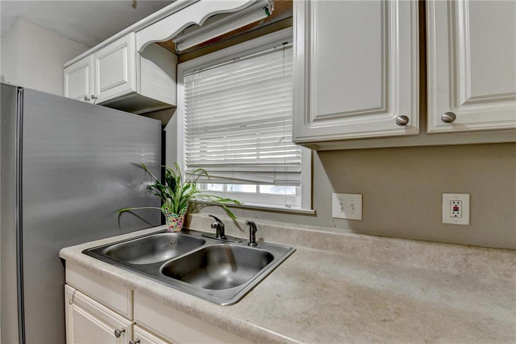 992 Old Holcomb Bridge Road Roswell, GA 30076 - Photo 17 of 34 a kitchen with sink and cabinets