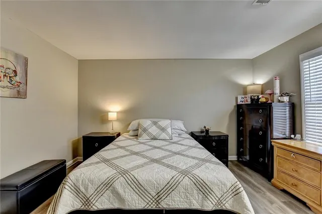 a bedroom with a bed and a dresser