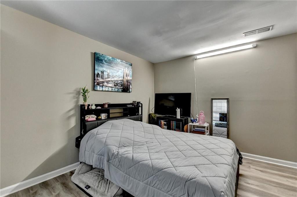 992 Old Holcomb Bridge Road Roswell, GA 30076 - Photo 27 of 34 a large white bed in a white room