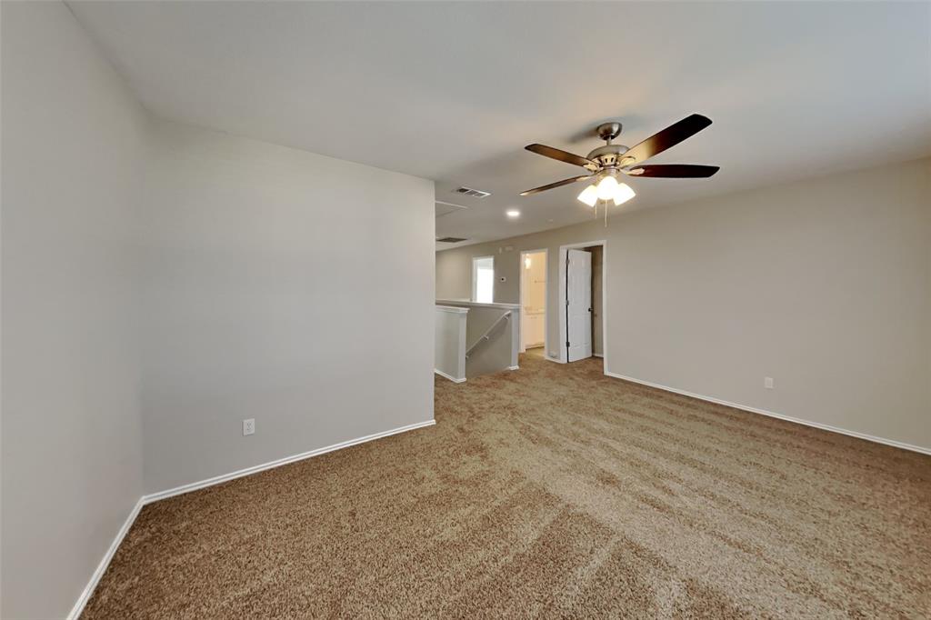 3925 Cane River Road Fort Worth, TX 76244 - Photo 18 of 21 Spare room with light colored carpet and baseboards