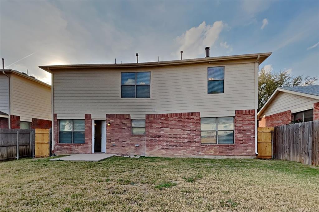 3925 Cane River Road Fort Worth, TX 76244 - Photo 19 of 21 Rear view of property with a patio area, a fenced backyard, and brick siding