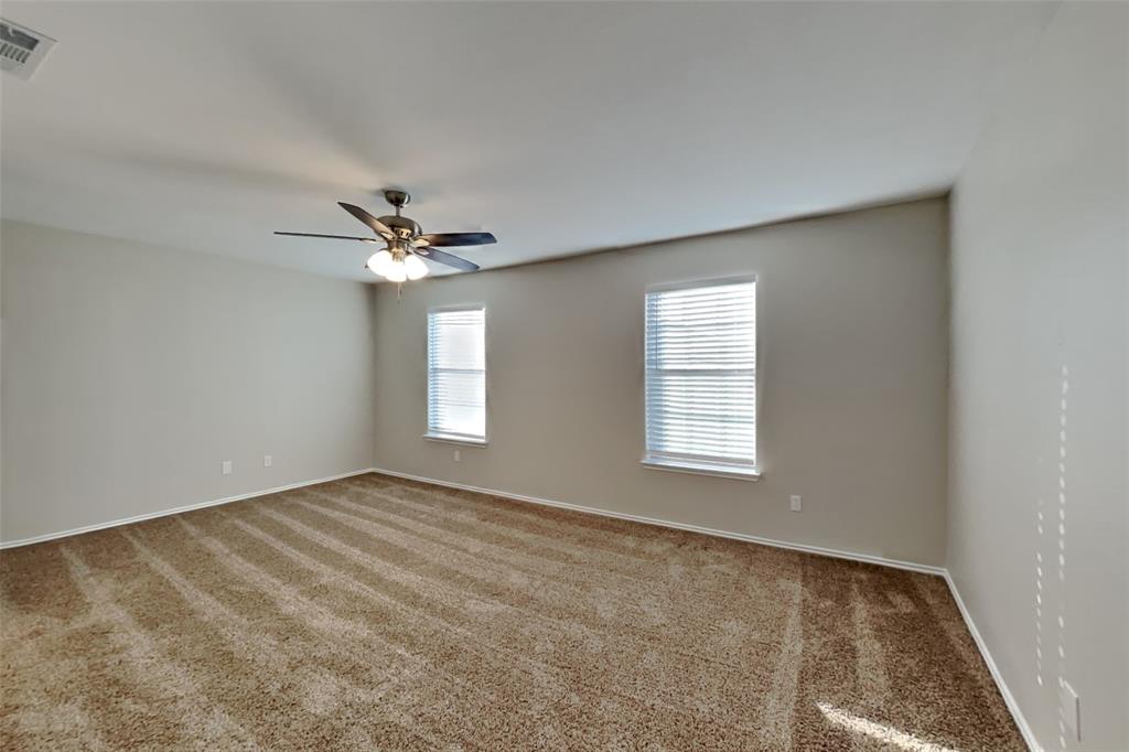 3925 Cane River Road Fort Worth, TX 76244 - Photo 9 of 21 Empty room featuring carpet flooring and ceiling fan