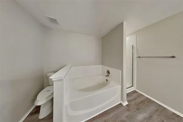 a white bath tub sitting in a bathroom