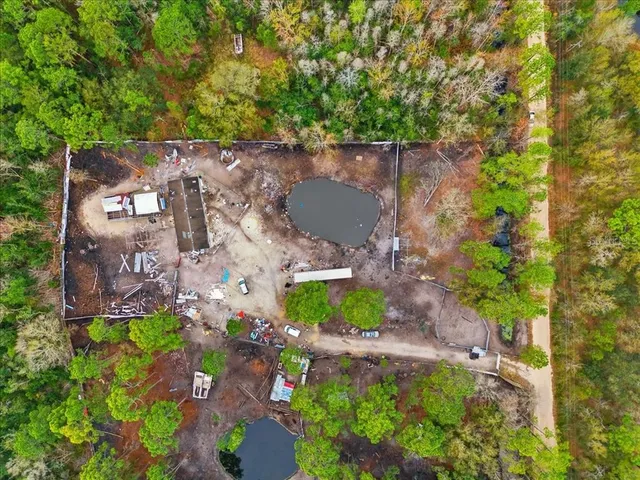 an aerial view of residential house with outdoor space