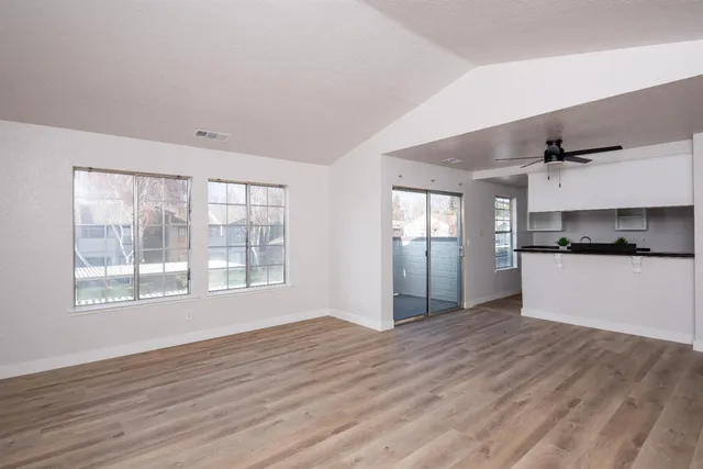 a view of kitchen with window and wooden floor