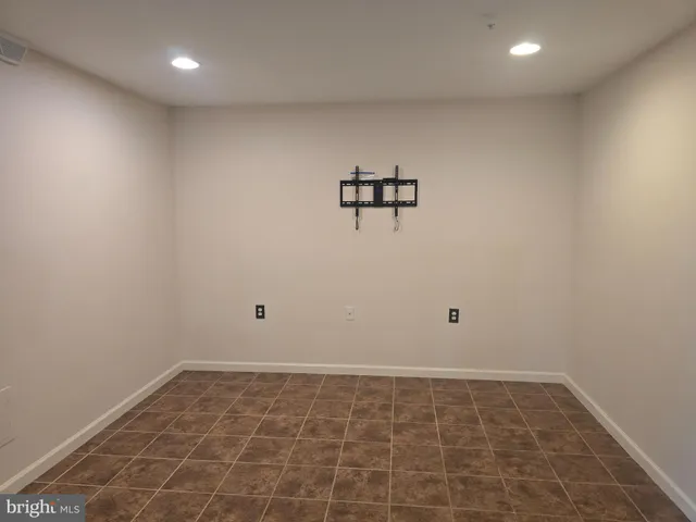 a view of an empty room with glass door