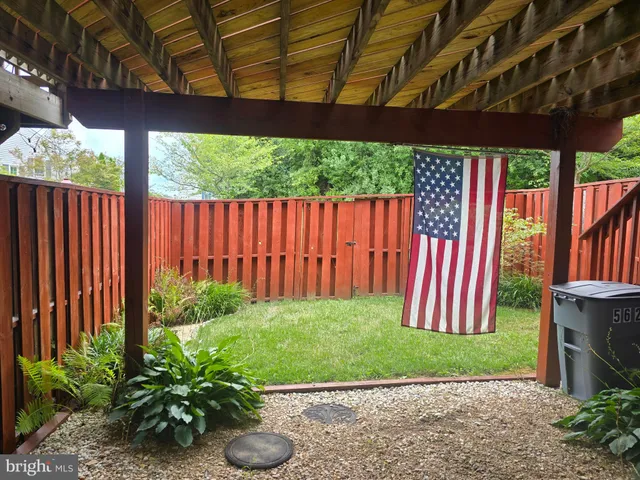 a view of a backyard with potted plants
