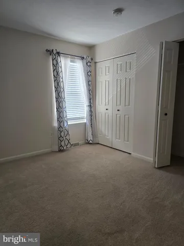 a view of empty room with windows